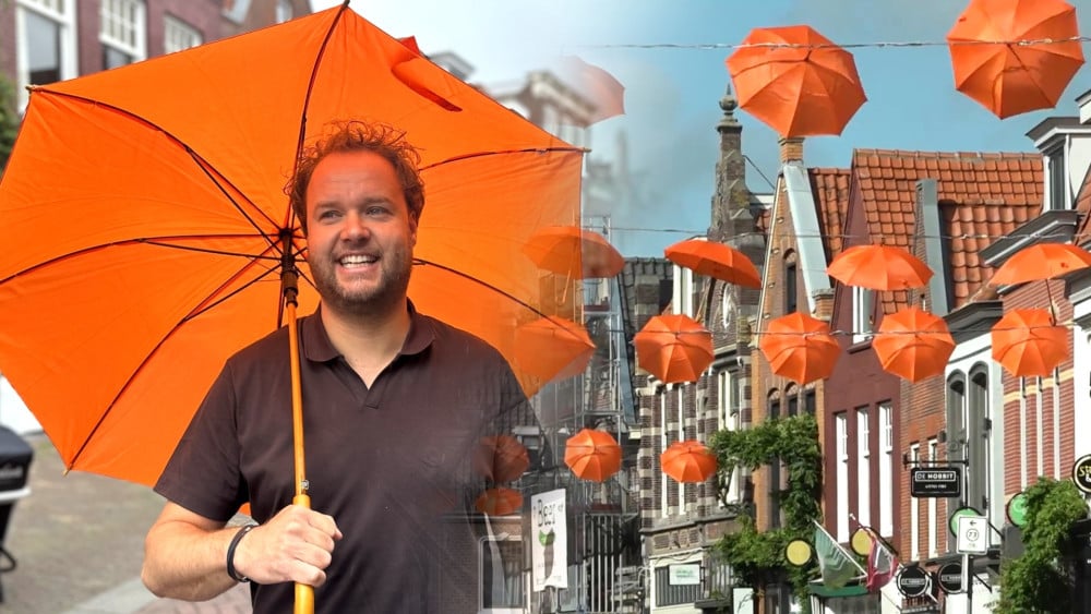 World Cup fever is in the air: Alkmaar street decorated with 100 orange umbrellas