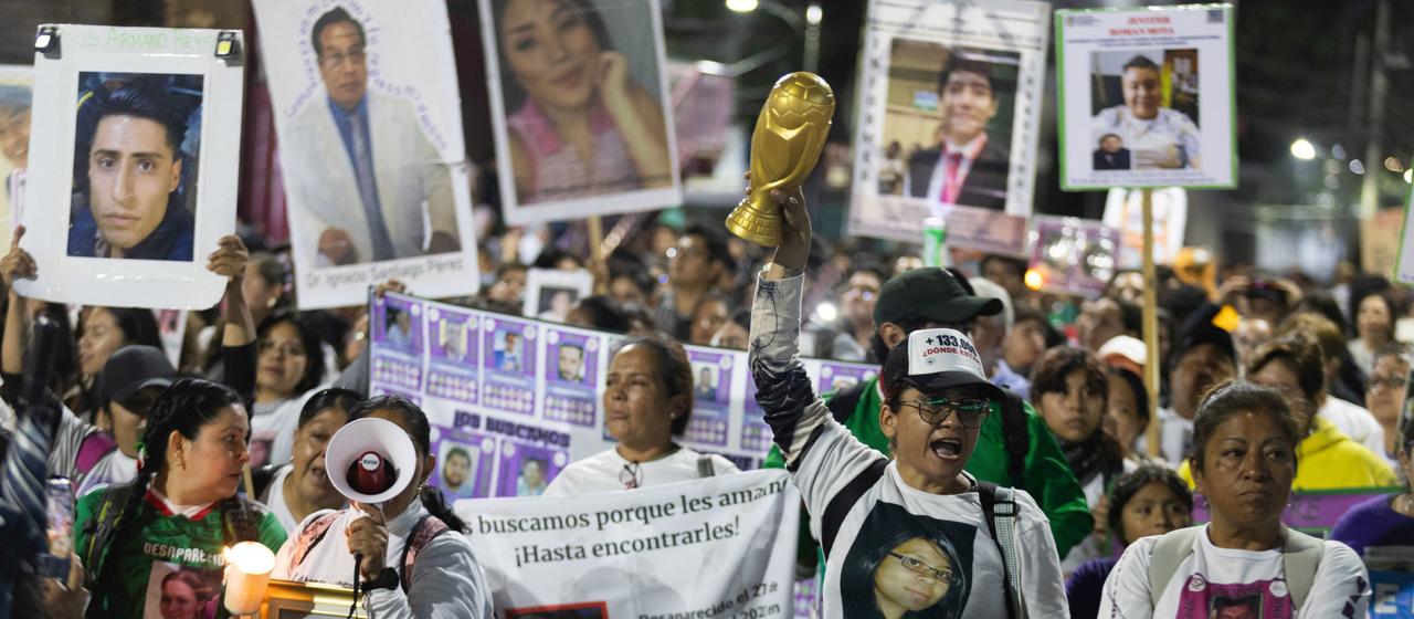 Relatives of missing people protest in Mexico before the opening of the World Cup