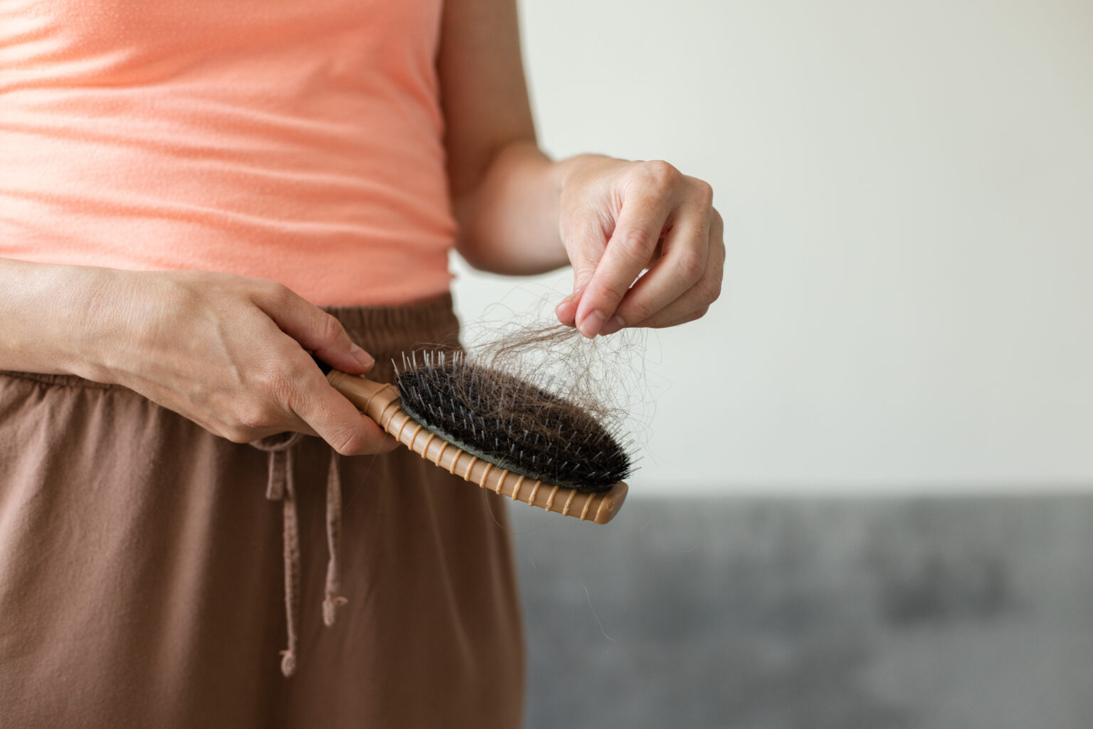 Understanding Postpartum Hair Loss: Causes and Solutions Explained