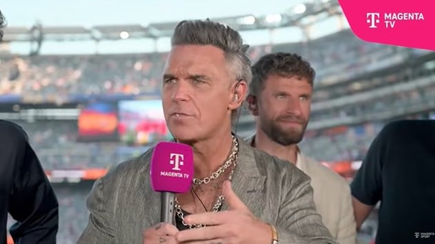What Did Robbie Williams Just Lose? Curious White Crumb Sparks Debate!